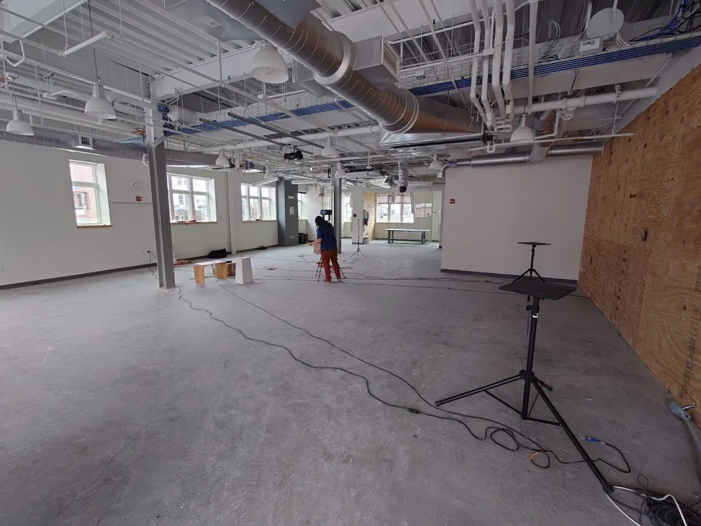 Performing acoustic tests in the raw space of the Dartmouth Warehouse for Sonic Art